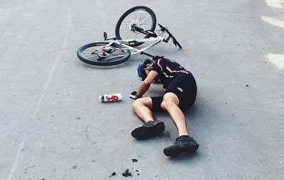 man fell off his bike ~ Accident Photo by Eugene Kukulka on Reshot